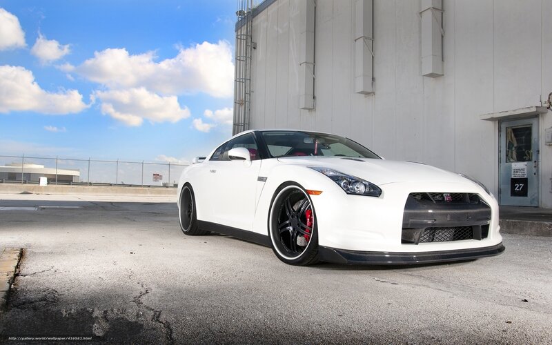White Sports Car — Dramatic, Afternoon, Photograph, Building, Clouds