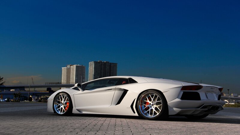 White Sports Car — Dramatic, Afternoon, Photograph, Buildings, Sky, Pavement