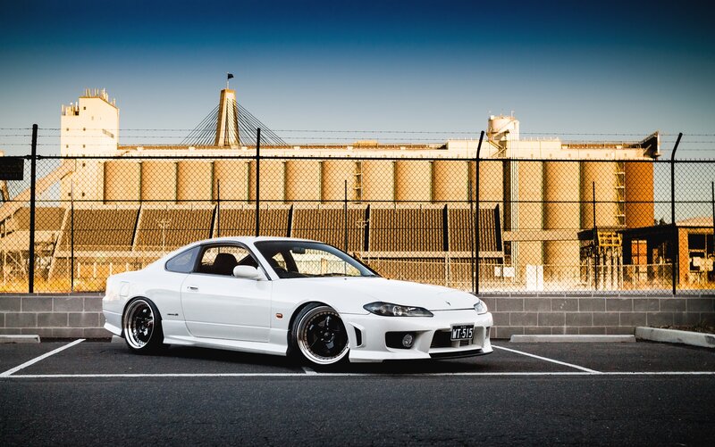 White Sports Car — Dramatic, Afternoon, Photograph, Fence