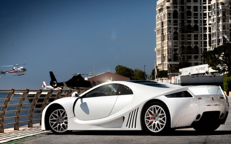 White Sports Car — Dramatic, Afternoon, Photograph, Helicopter, Building