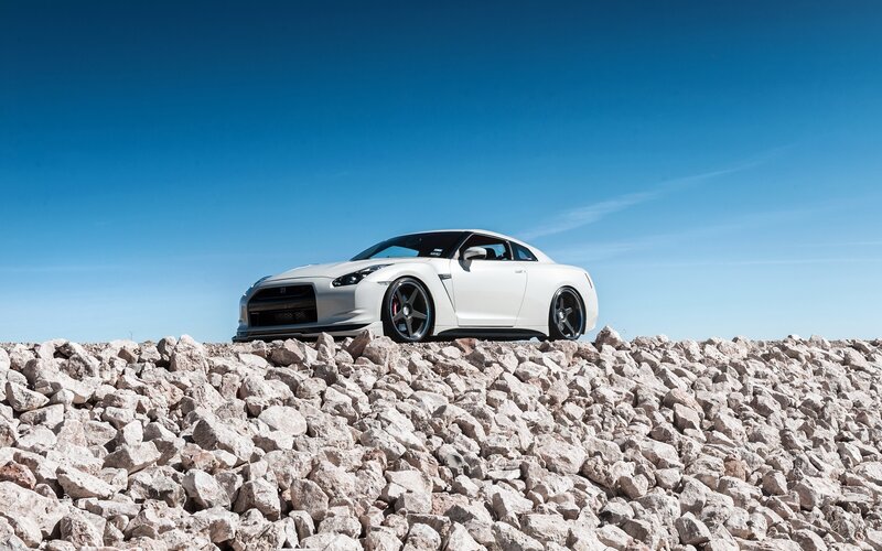 White Sports Car — Dramatic, Afternoon, Photograph, Rocks, Sky, Blue
