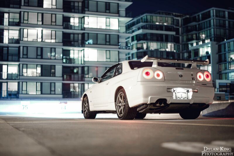 White Sports Car — Dramatic, Night, Photograph, Apartment Buildings