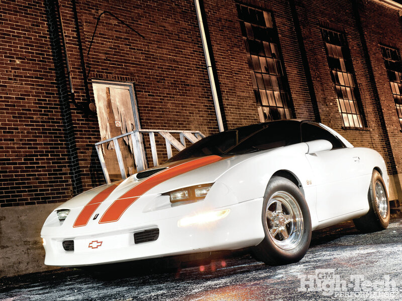 White Sports Car — Dramatic, Night, Photograph, Brick Building