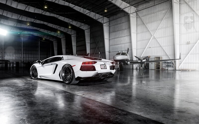 White Sports Car — Dramatic, Photograph, Airplane, Hangar, Concrete Floor
