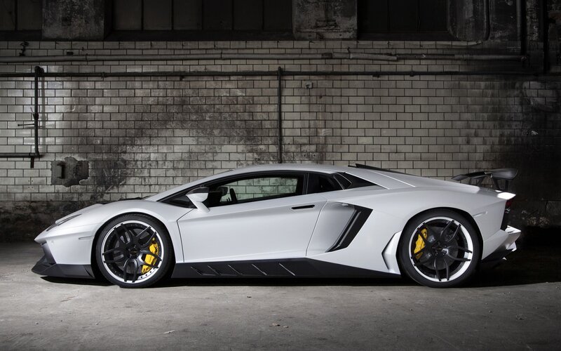 White Sports Car — Dramatic, Photograph, Brick Wall, Concrete Floor, Tire