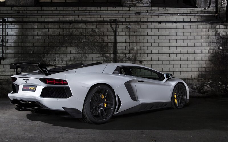 White Sports Car — Dramatic, Photograph, Brick Wall, Tire