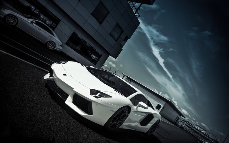 White Sports Car — Dramatic, Photograph, Building, Sky