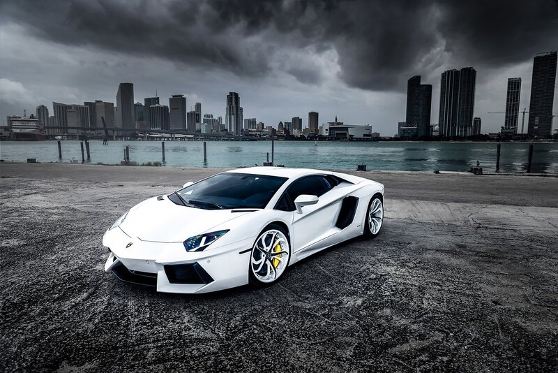 White Sports Car — Dramatic, Photograph, City Skyline, Water, Skyscraper