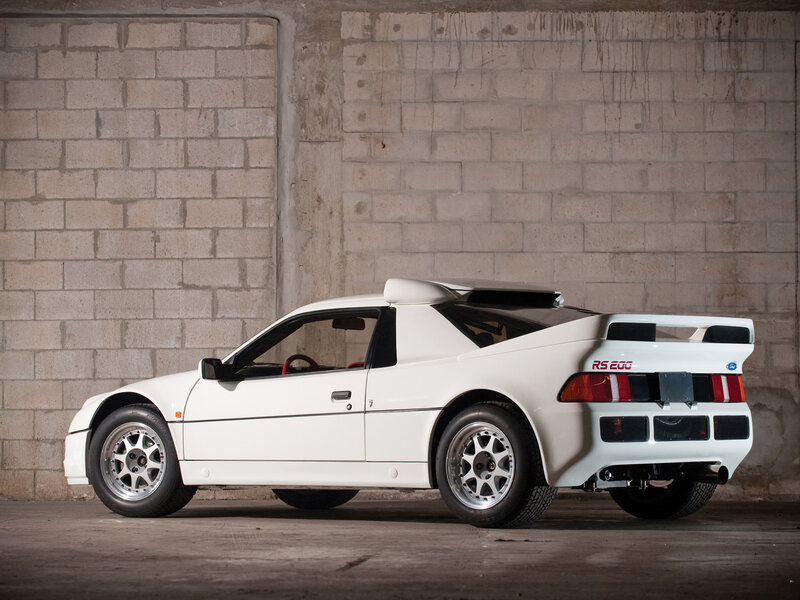 White Sports Car — Dramatic, Photograph, Concrete Wall