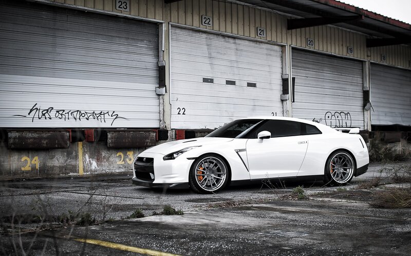 White Sports Car — Dramatic, Photograph, Garage Doors, Graffiti, Concrete