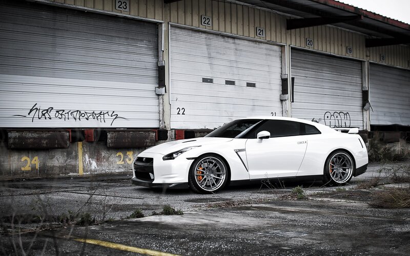 White Sports Car — Dramatic, Photograph, Garage Doors, Graffiti, Wheels, Gray