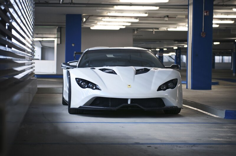 White Sports Car — Dramatic, Photograph, Parking Garage, Blue Pillars