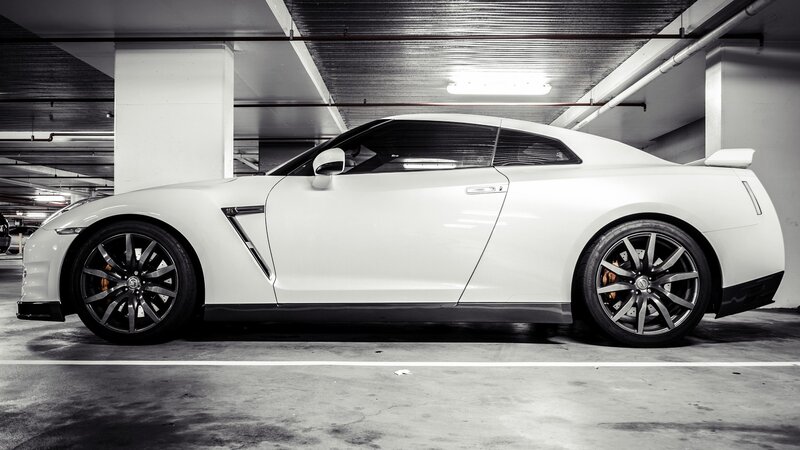 White Sports Car — Dramatic, Photograph, Parking Garage, Ceiling