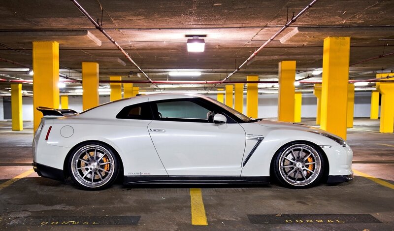 White Sports Car — Dramatic, Photograph, Parking Garage, Yellow Pillars, Black