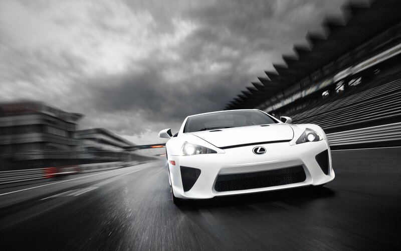 White Sports Car — Dramatic, Photograph, Race Track, Cloudy Sky, Bleachers