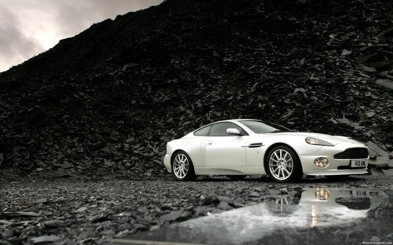 White Sports Car — Dramatic, Photograph, Rock Pile, Puddle