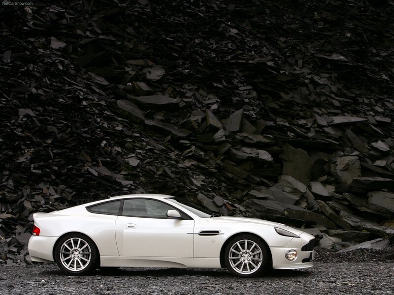 White Sports Car — Dramatic, Photograph, Rocks, Gravel