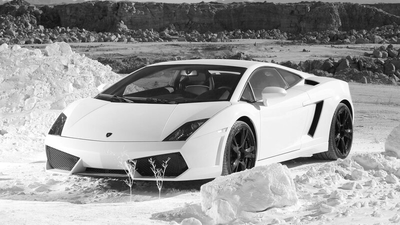 White Sports Car — Dramatic, Photograph, Rocks, Snow