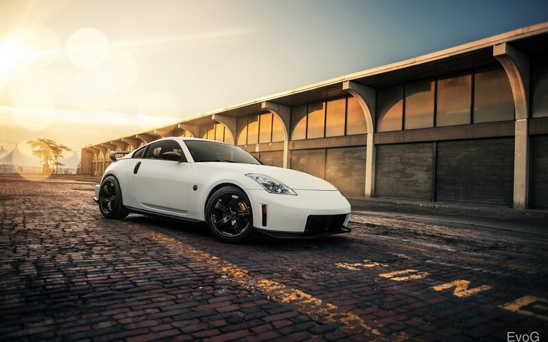 White Sports Car — Dramatic, Sunset, Photograph, Brick Road