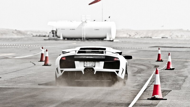White sports car drifting