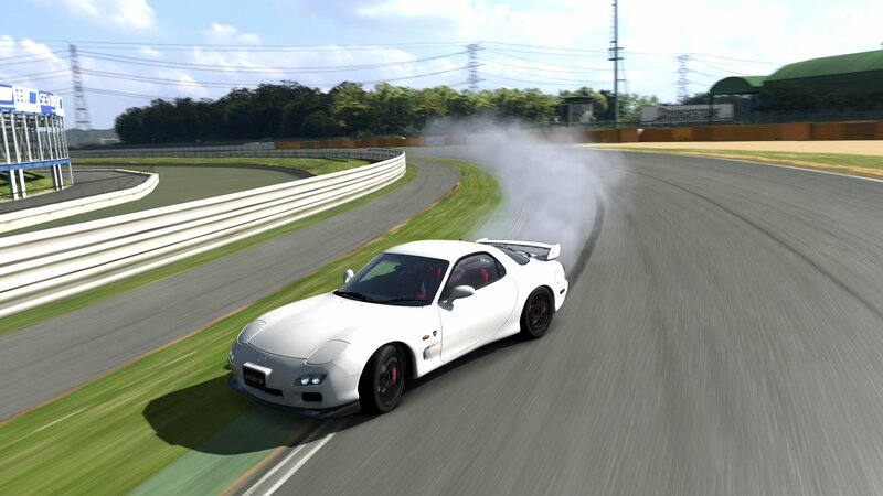 White sports car drifting