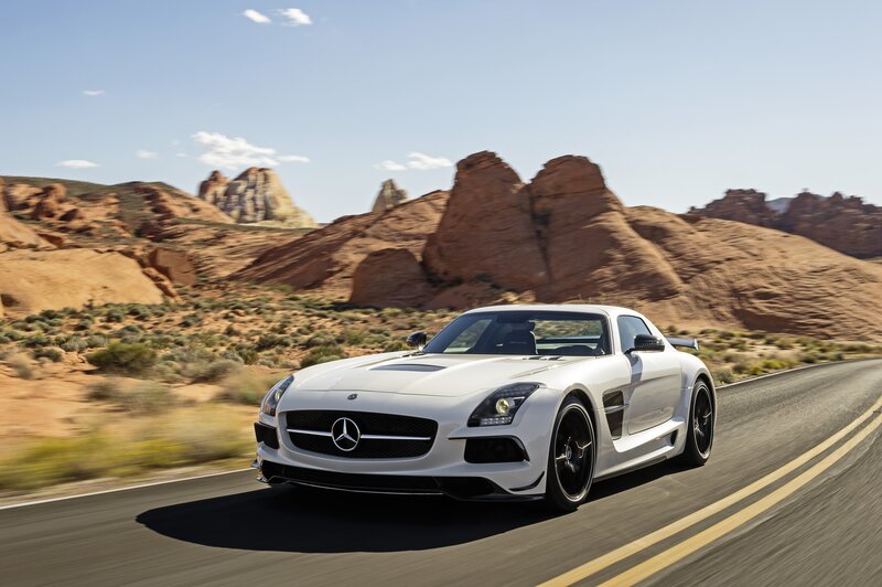 White Sports Car — Dynamic, Afternoon, Photograph, Road, Desert, Rock Formations, Brown, Blue