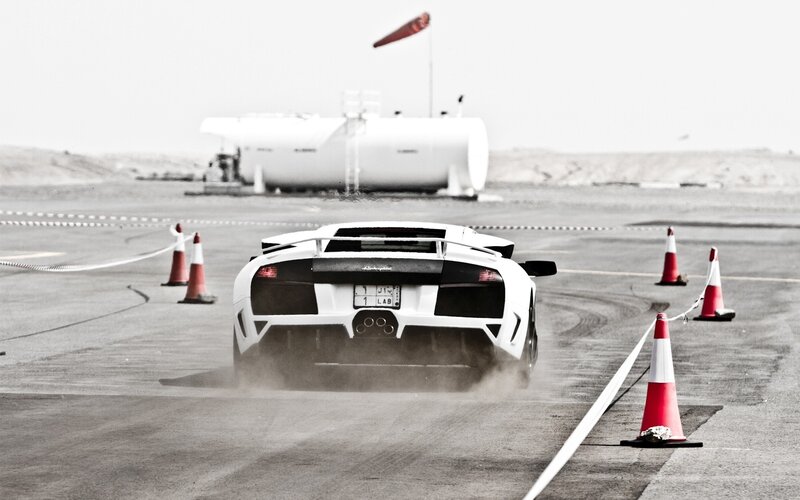 White Sports Car — Dynamic, Photograph, Traffic Cones