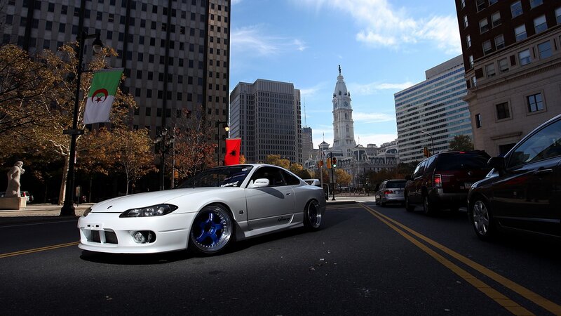 White sports car in city street