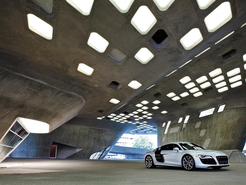 White sports car in concrete structure