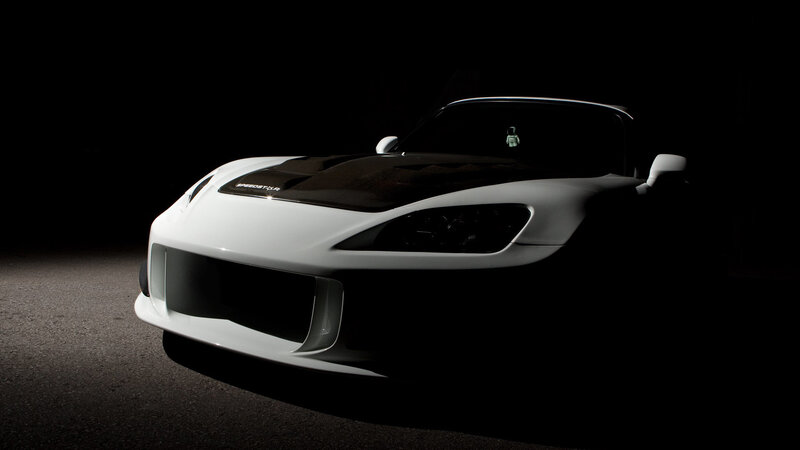 white sports car in dark setting