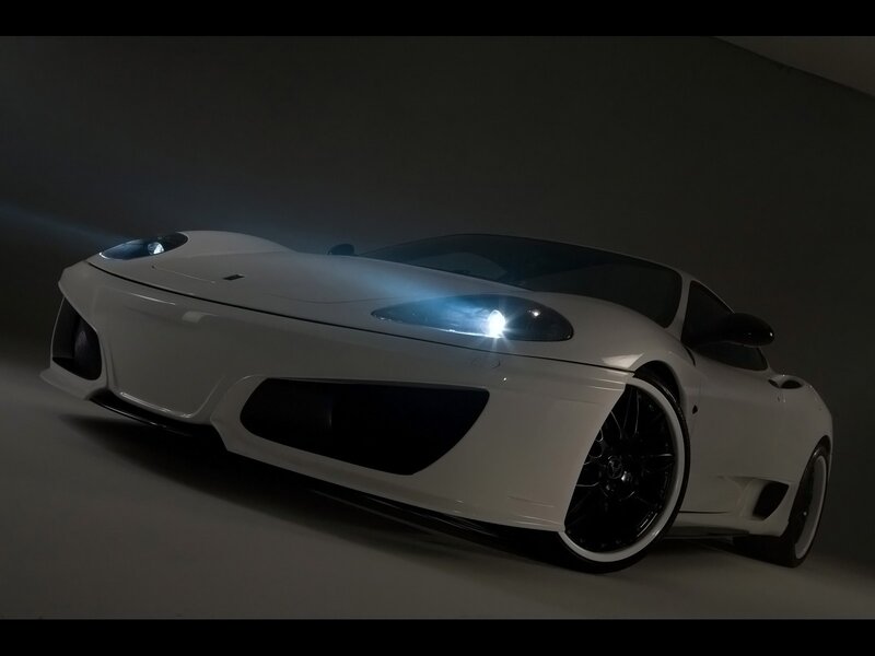 white sports car in dark studio