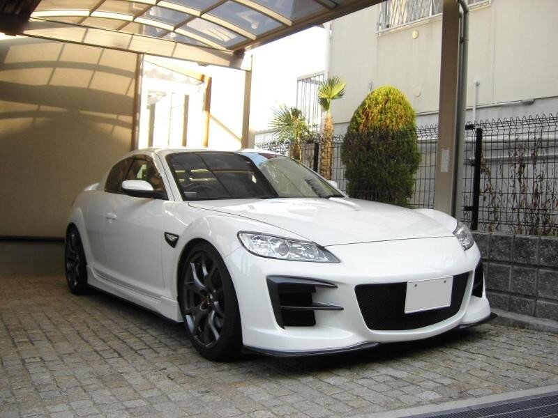 White sports car in driveway