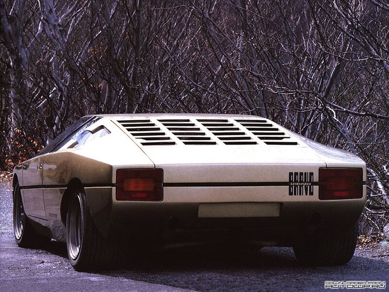 white sports car in forest