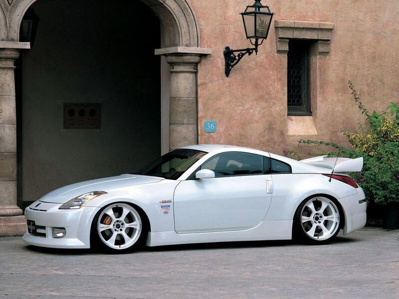 White sports car in front of building