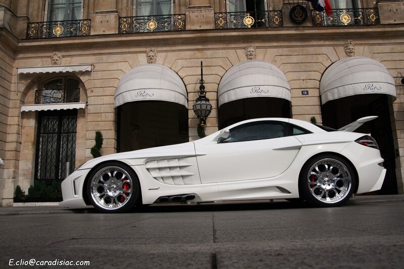 White sports car in front of hotel