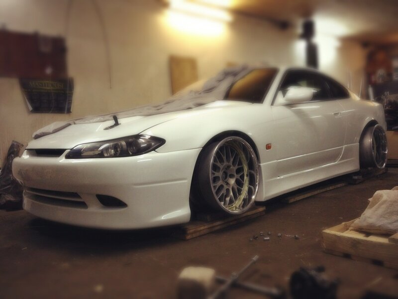 White sports car in garage