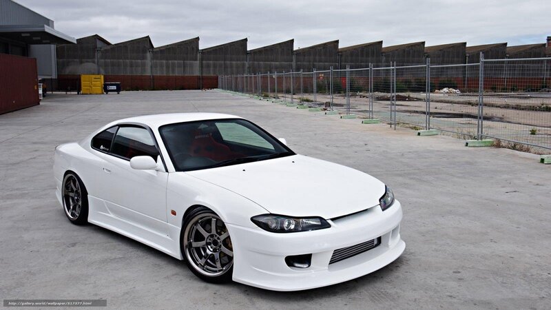 white sports car in industrial lot