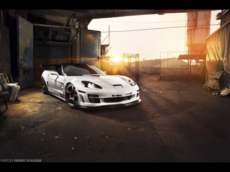 White sports car in industrial setting