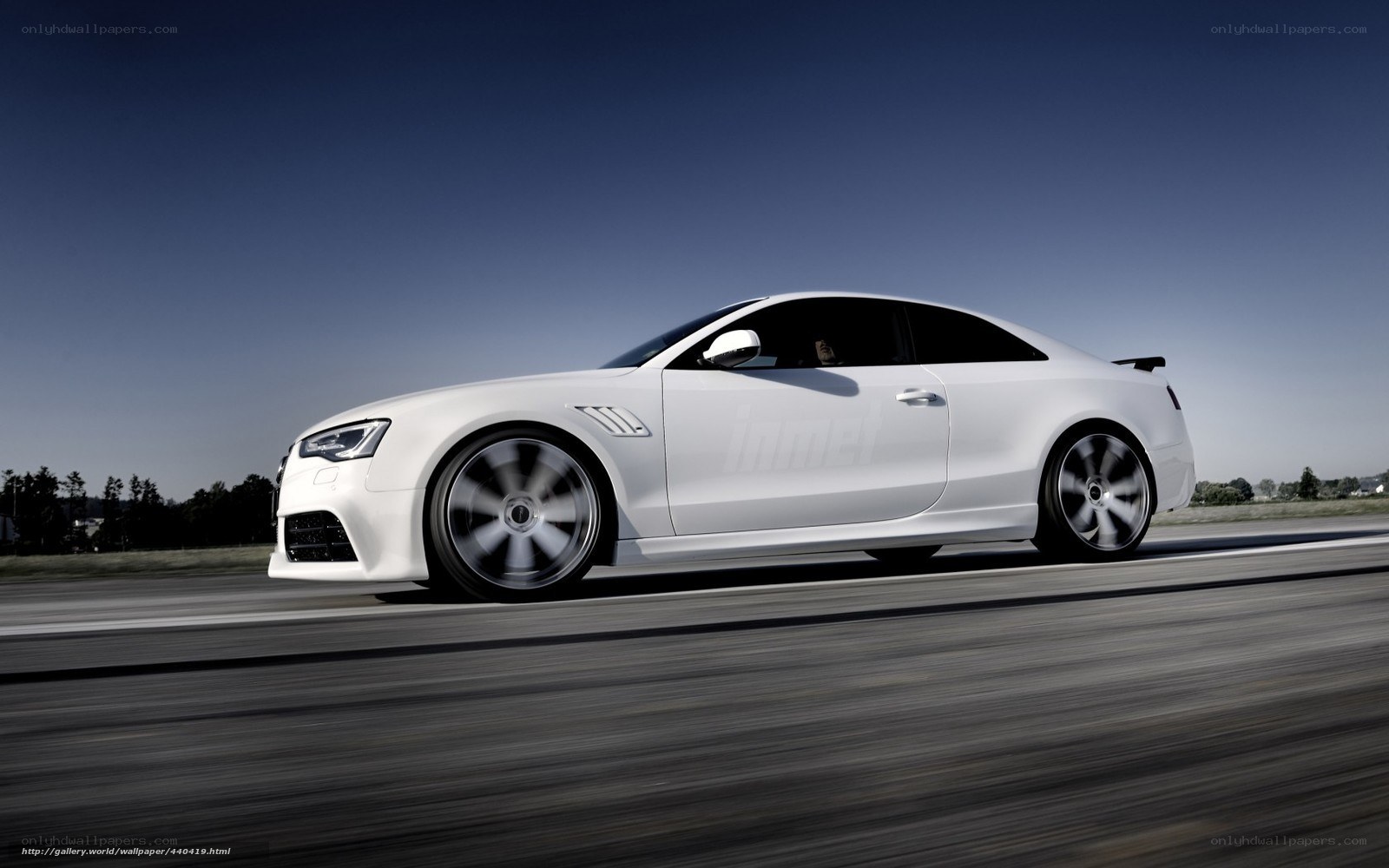 white sports car in motion