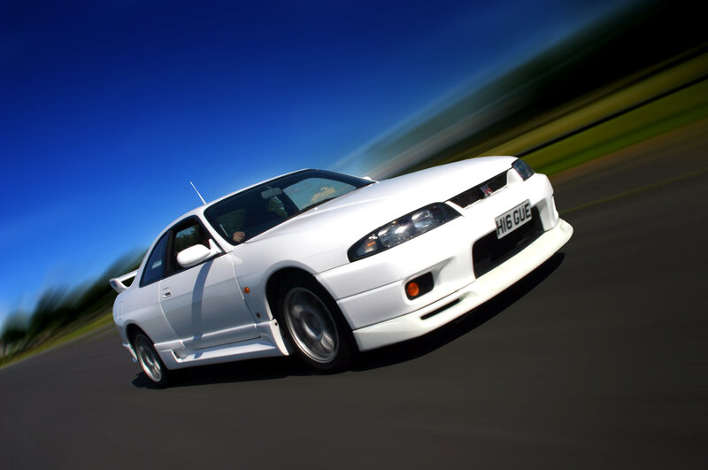 white sports car in motion