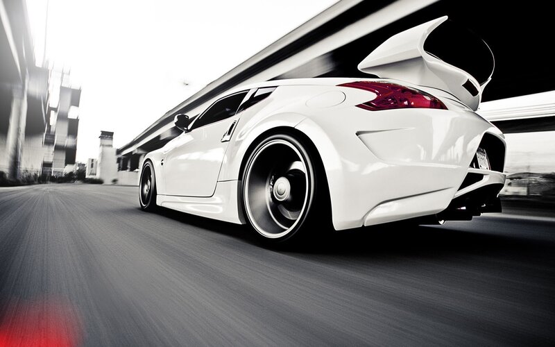white sports car in motion