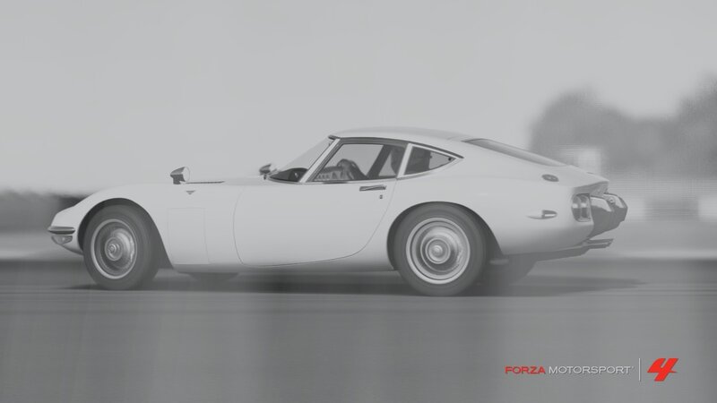 white sports car in motion