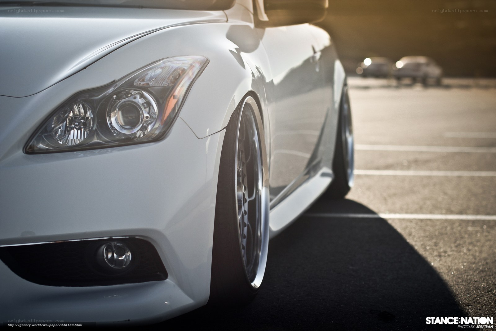 white sports car in parking lot