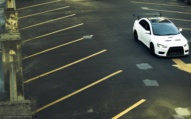 White sports car in parking lot
