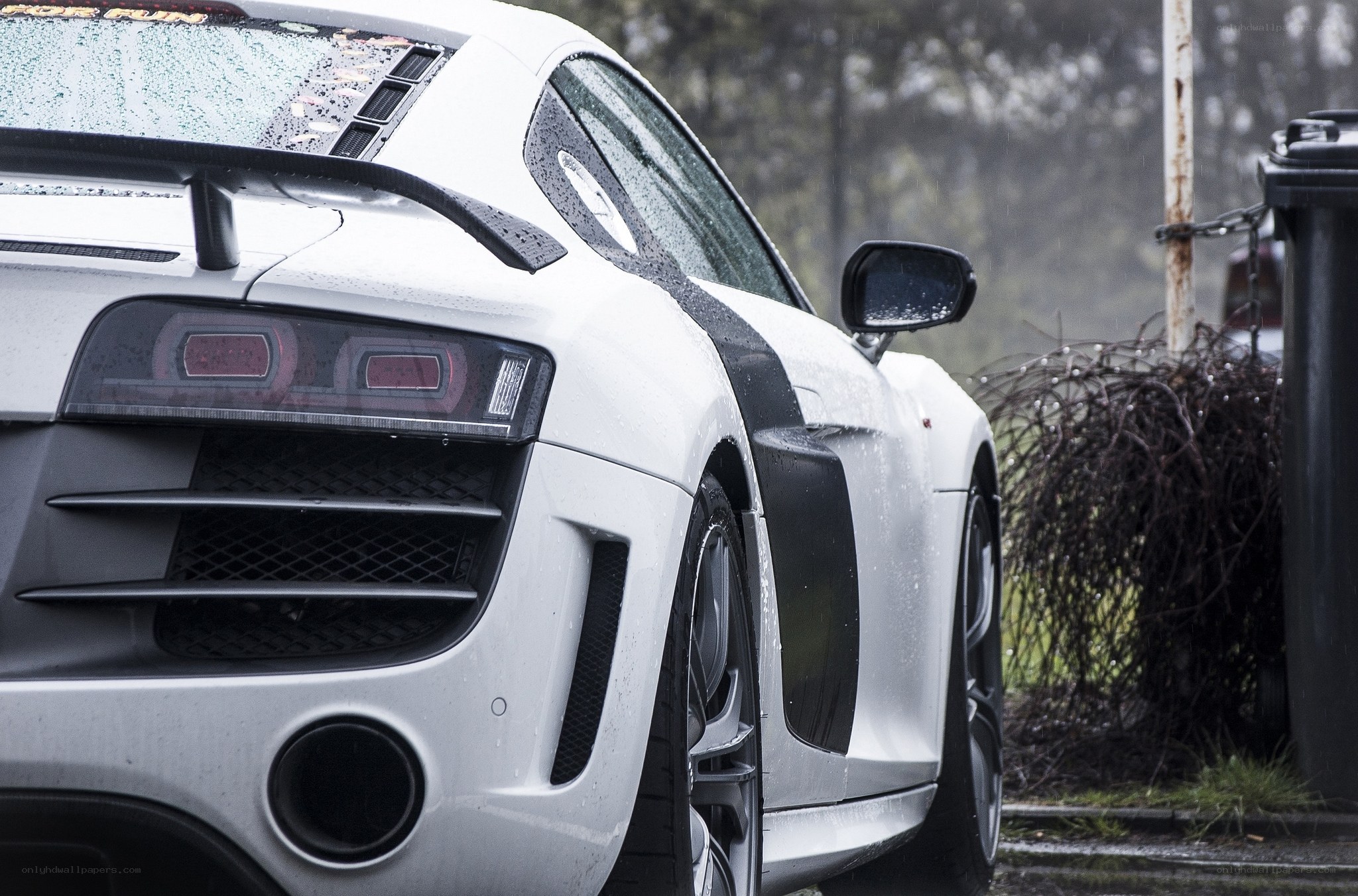 white sports car in rain