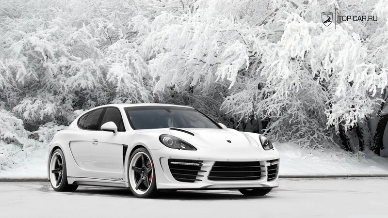 White sports car in snowy forest