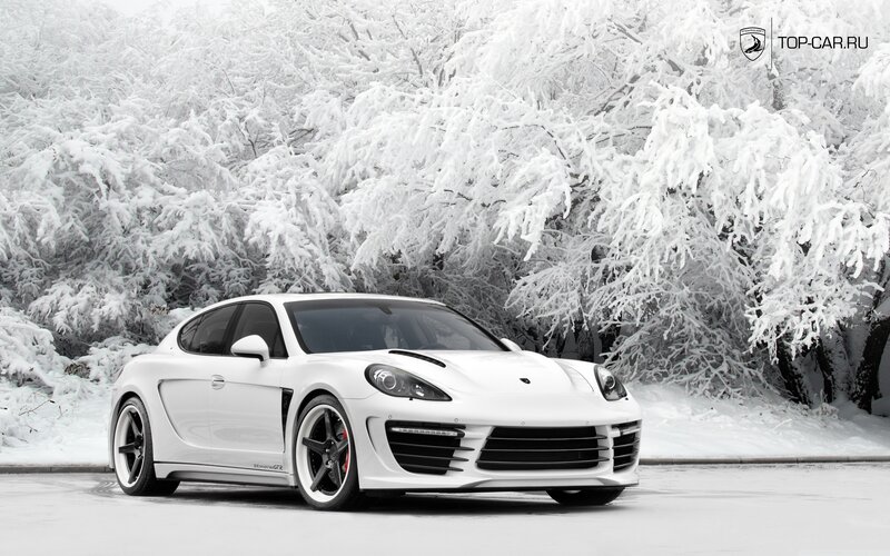 White sports car in snowy forest