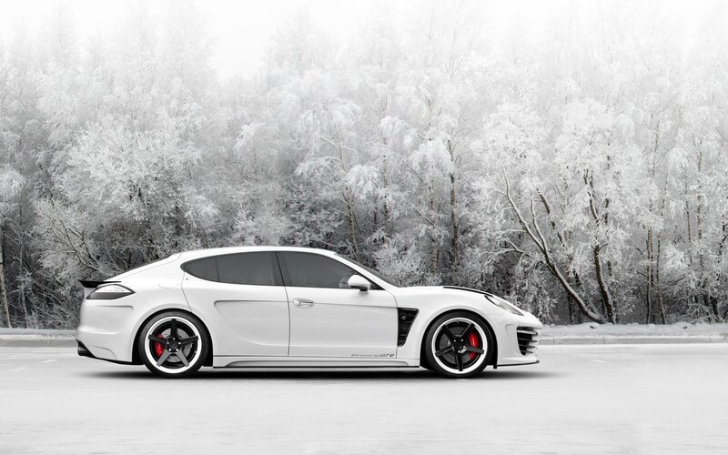 White sports car in snowy forest