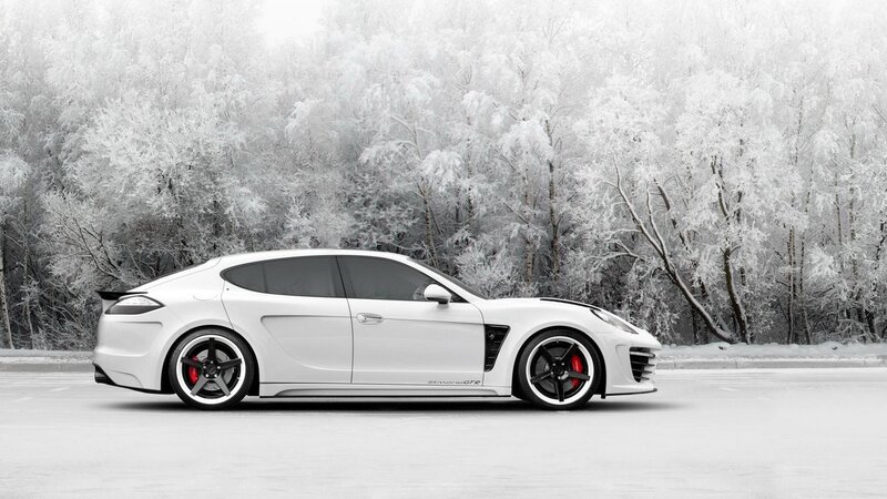 White sports car in snowy forest