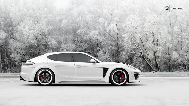 White sports car in snowy forest
